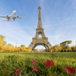 Airplane flying over Eiffel Tower, Paris, France. Eiffel Tower i