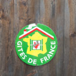 A sign « Gite de France  » B&B in french on wooden background