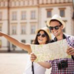 20676868 – happy tourist sightseeing city with map