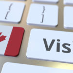 VISIT text and flag of Canada on the buttons on the computer keyboard. Conceptual 3D rendering